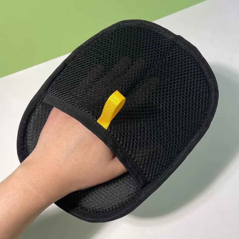 FurAway pet grooming glove with its yellow fabric pull tab.